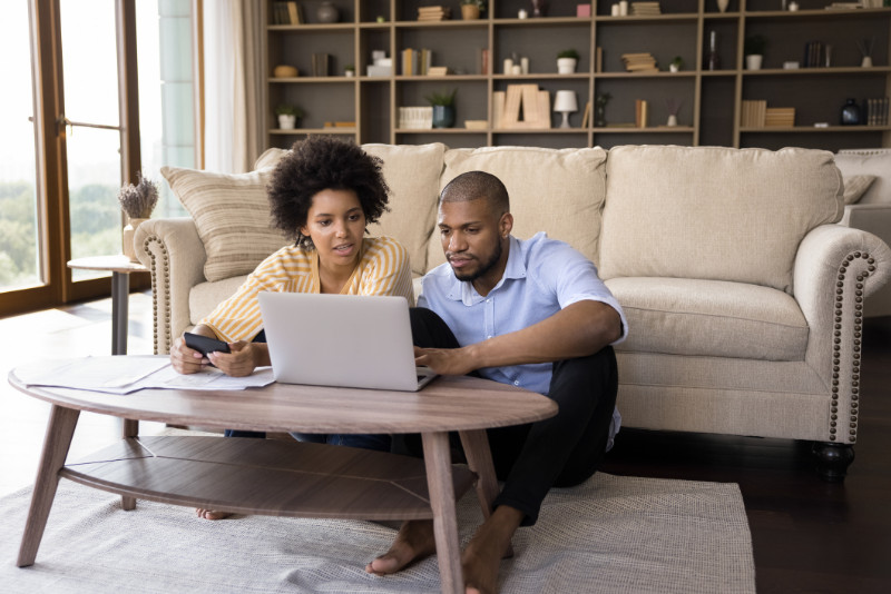 A couple paying bills online